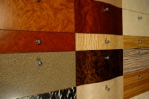 A display of curved and veneered drawer front panels