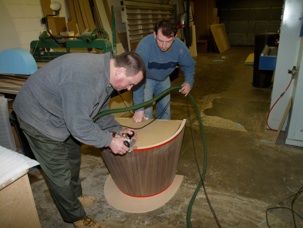 Trimming a conical vacuum pressed panel